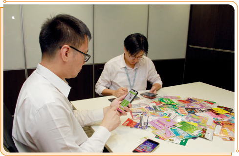 Staff members of OFCA conducting a regular check on the RNR Programme platforms provided by TSPs.