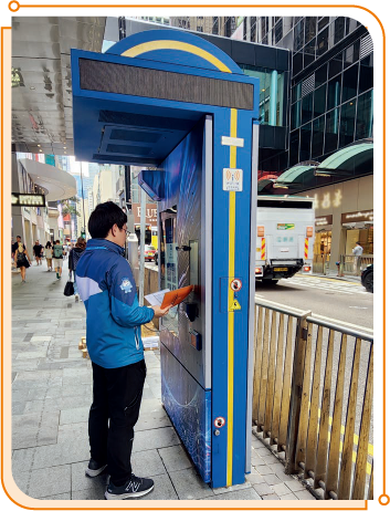 A staff member of OFCA testing Smart Kiosk services in Central.